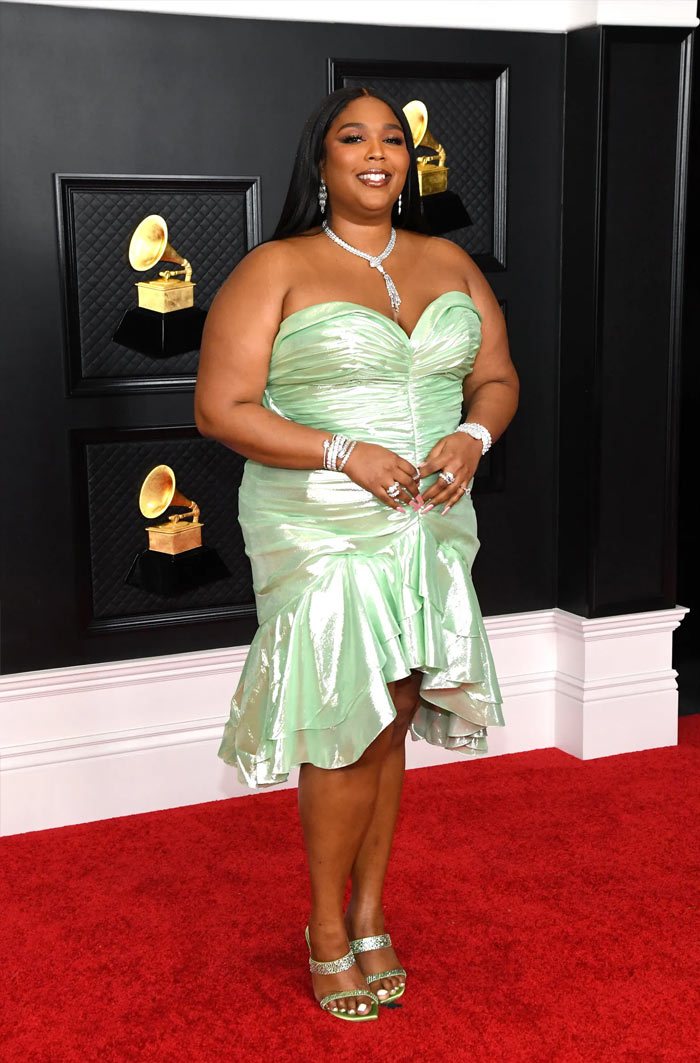 Lizzo in Balmain, BVLGARI Serpenti jewelry and Stuart Weitzman shoes Grammys 2021